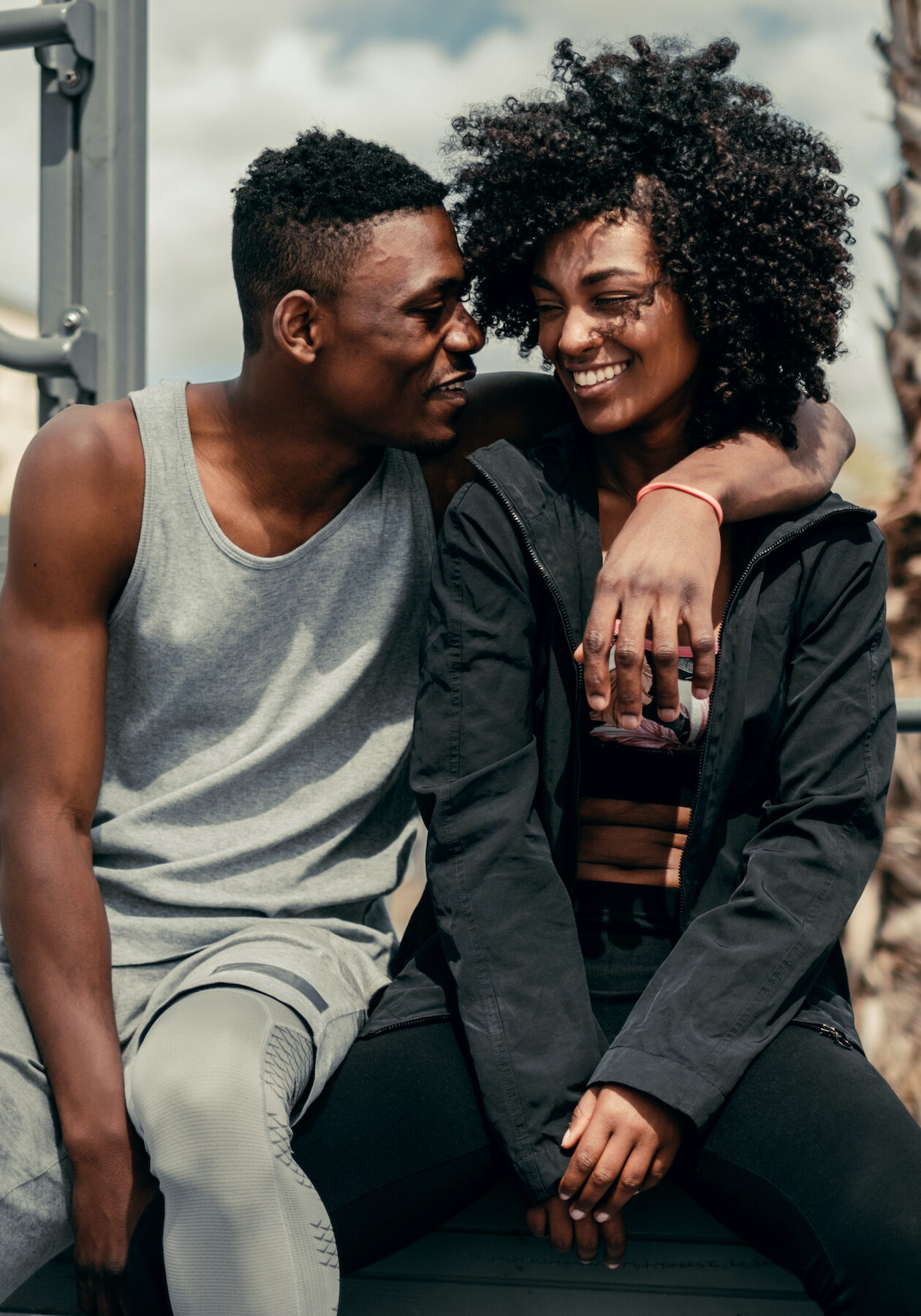 Young happy black couple outdoors